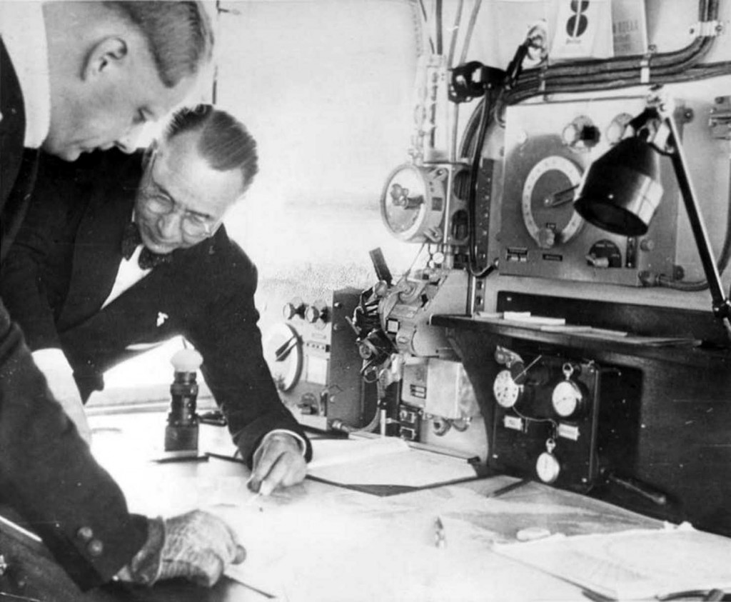 Ernst Lehmann and Knut Eckener examining charts in Hindenburg's Navigation Room. (The eyepiece of the Zeiss drift measuring telescope can be seen beneath Lehmann's shoulder.) 