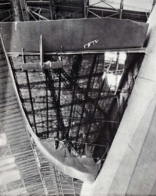 The damaged port fin after arrival at Lakehurst (view from floor of hangar)