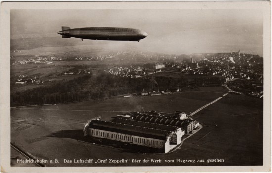 LZ-127 Graf Zeppelin over the airship hangars at Friedrichshafen