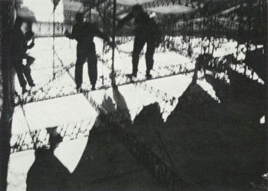 Repair party fixing the covering of Graf Zeppelin's fin, showing the extensive damage suffered in the squall.