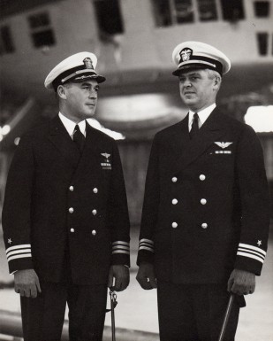 Lt. Cdr. Herbert V.Wiley (right) assuming command of USS Macon from Cdr. Alger H. Dresel